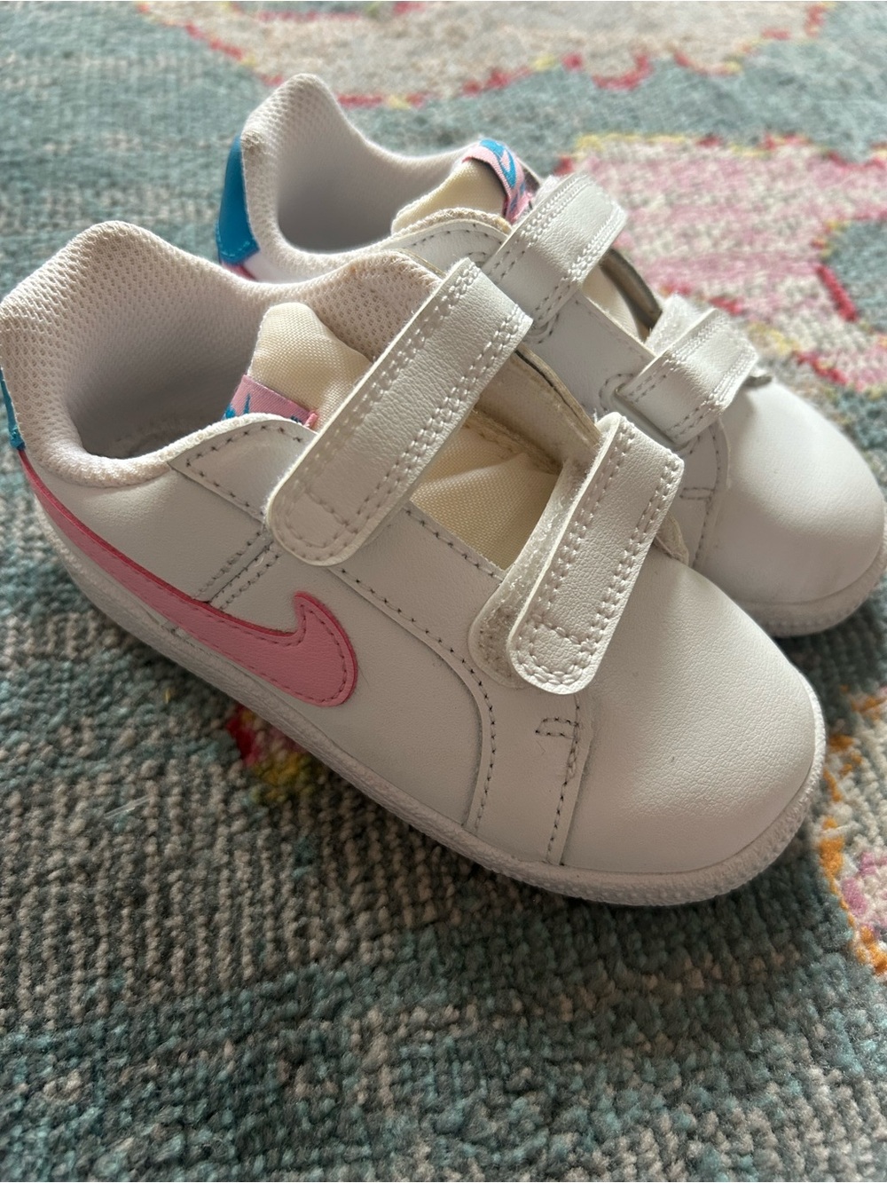 Nike Kids White Sneakers with Pink Swoosh and Blue Heel Tab
